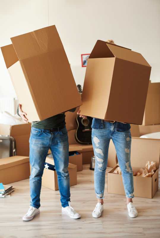 couple-faces-cardboard-boxes
